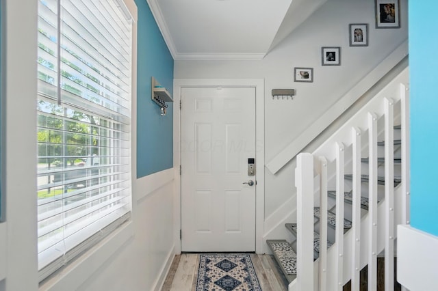 2201 Teardrop Ave Unit 34A, Columbus, OH 43235 - doorway to outside with crown molding, light wood-style floors, and stairs