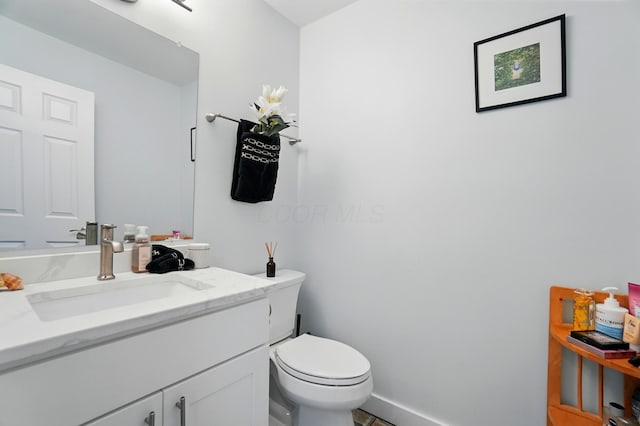 2201 Teardrop Ave Unit 34A, Columbus, OH 43235 - half bathroom with toilet, vanity, and baseboards