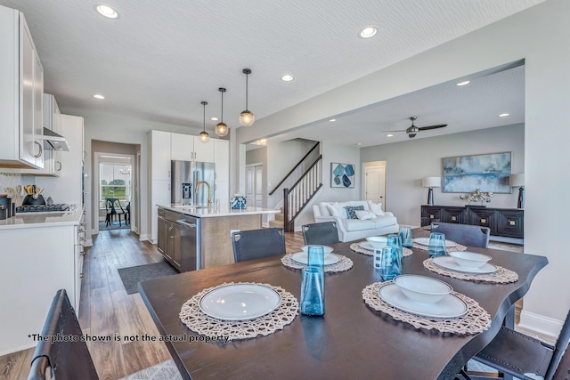 266 Willow Way, Newark, OH 43055 - dining space with ceiling fan, wood finished floors, stairway, recessed lighting, and baseboards