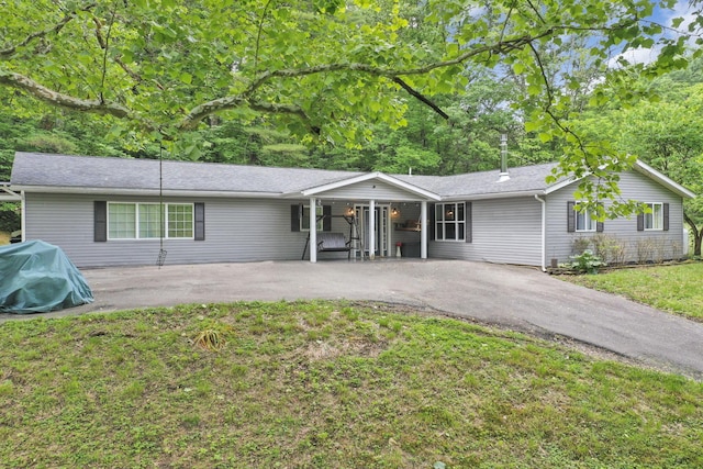 8175 Vore Ridge Rd, Athens, OH 45701 - ranch-style house with driveway and a front lawn