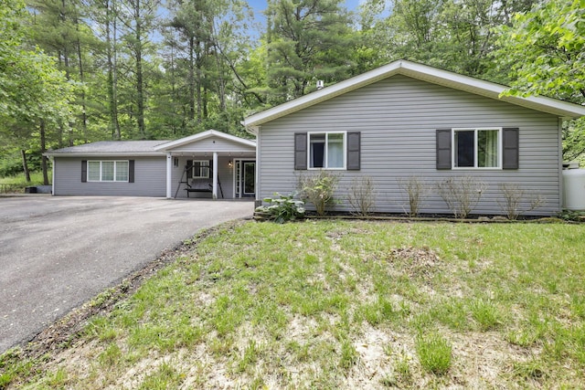 8175 Vore Ridge Rd, Athens, OH 45701 - ranch-style house featuring asphalt driveway and a front yard