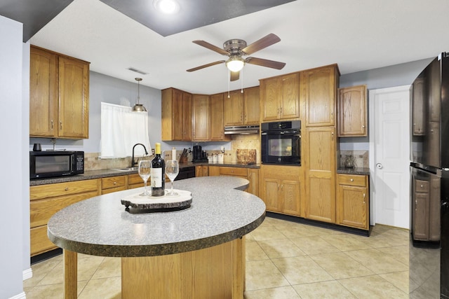 8175 Vore Ridge Rd, Athens, OH 45701 - kitchen featuring black appliances, under cabinet range hood, ceiling fan, light tile patterned flooring, and a center island