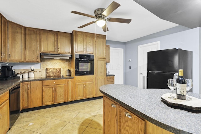 8175 Vore Ridge Rd, Athens, OH 45701 - kitchen featuring black appliances, under cabinet range hood, a ceiling fan, light tile patterned floors, and brown cabinets