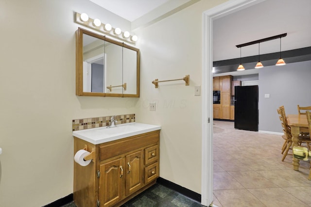8175 Vore Ridge Rd, Athens, OH 45701 - bathroom featuring vanity, backsplash, and baseboards