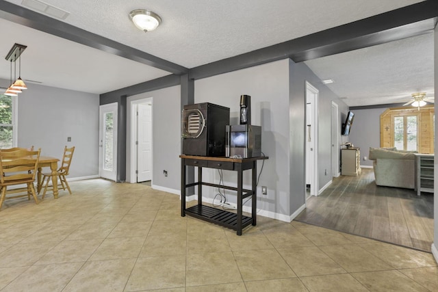 8175 Vore Ridge Rd, Athens, OH 45701 - entrance foyer with a textured ceiling, tile patterned floors, ceiling fan, and baseboards