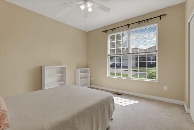 6370 Portrait Cir Unit 103, Westerville, OH 43081 - bedroom with multiple windows, baseboards, carpet flooring, and ceiling fan