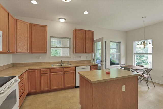 6370 Portrait Cir Unit 103, Westerville, OH 43081 - kitchen with white appliances, a sink, healthy amount of natural light, a chandelier, and recessed lighting