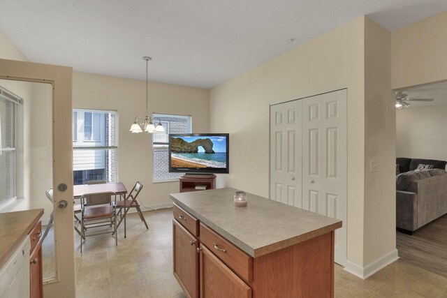 6370 Portrait Cir Unit 103, Westerville, OH 43081 - kitchen with a chandelier, a kitchen island, ceiling fan, decorative light fixtures, and white dishwasher