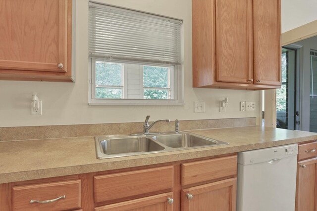 6370 Portrait Cir Unit 103, Westerville, OH 43081 - kitchen featuring white dishwasher, a sink, and light countertops