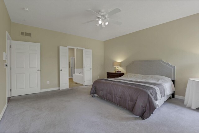 6370 Portrait Cir Unit 103, Westerville, OH 43081 - carpeted bedroom with baseboards, ensuite bath, and ceiling fan