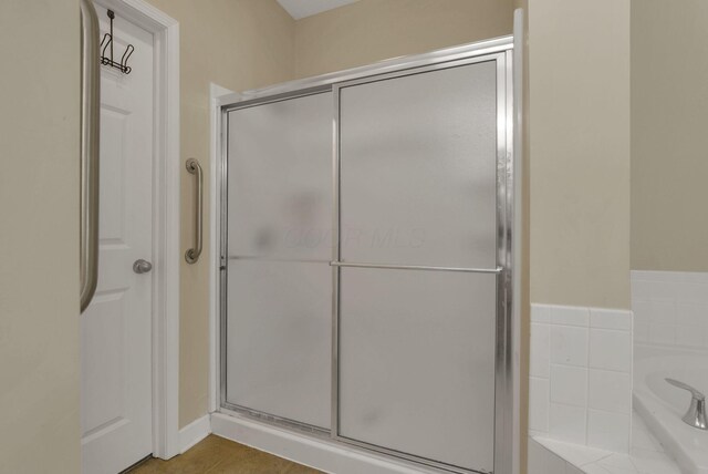6370 Portrait Cir Unit 103, Westerville, OH 43081 - full bathroom featuring a stall shower, a bath, and tile patterned flooring