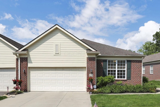 6370 Portrait Cir Unit 103, Westerville, OH 43081 - view of front of home with brick siding, driveway, and an attached garage