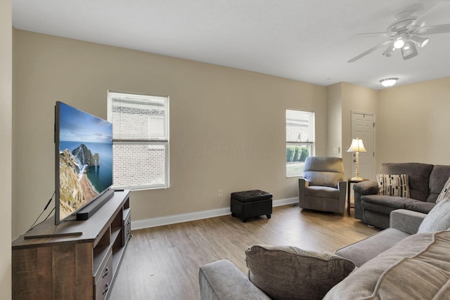 6370 Portrait Cir Unit 103, Westerville, OH 43081 - living room with wood finished floors, ceiling fan, and baseboards
