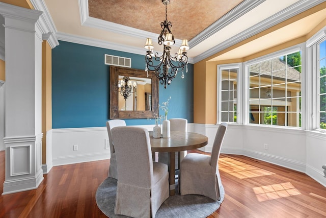 5753 Aster Way, Galena, OH 43021 - dining room featuring healthy amount of natural light, wood finished floors, a chandelier, and crown molding