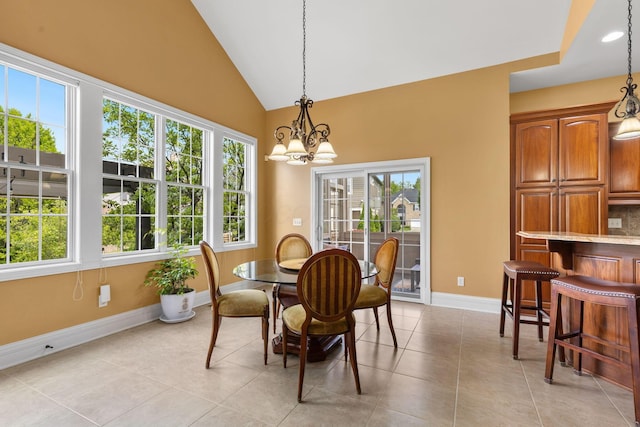 5753 Aster Way, Galena, OH 43021 - dining space with a chandelier, healthy amount of natural light, baseboards, lofted ceiling, and recessed lighting