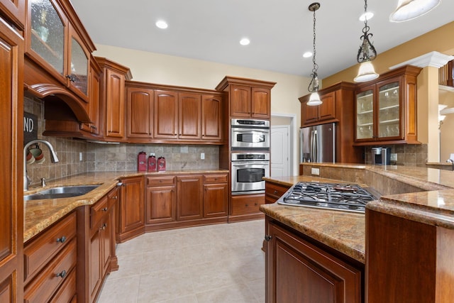 5753 Aster Way, Galena, OH 43021 - kitchen with a sink, appliances with stainless steel finishes, backsplash, decorative light fixtures, and light tile patterned flooring