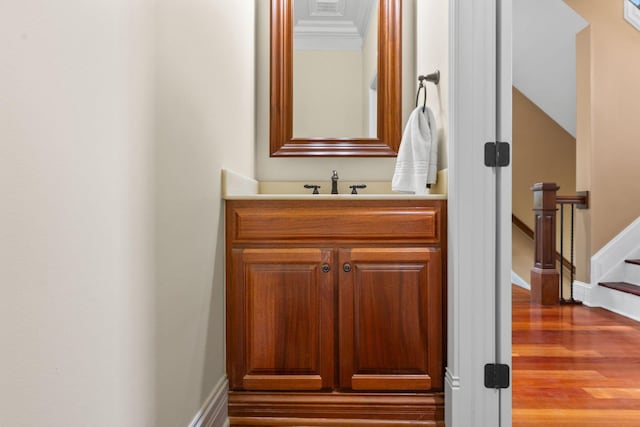 5753 Aster Way, Galena, OH 43021 - half bath with vanity, wood finished floors, crown molding, and baseboards