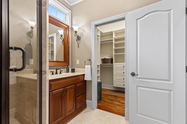 5753 Aster Way, Galena, OH 43021 - full bathroom featuring vanity, a spacious closet, and a stall shower