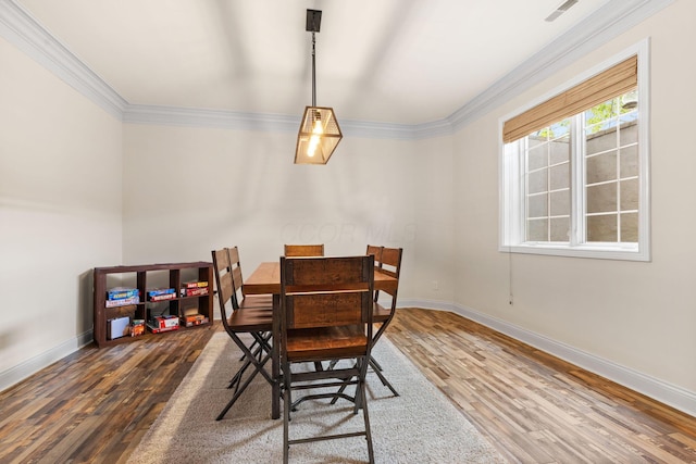 5753 Aster Way, Galena, OH 43021 - dining space featuring wood finished floors, baseboards, and ornamental molding