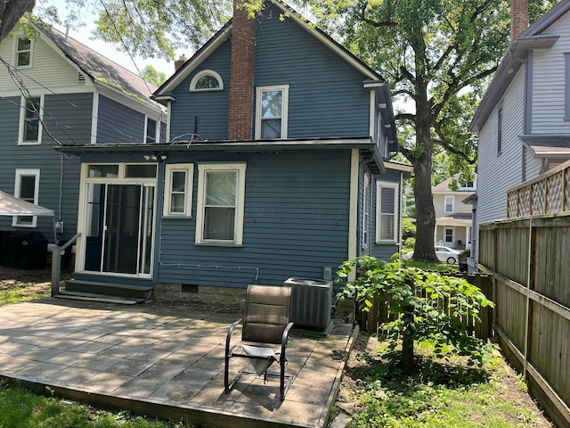 170 E Maynard Ave, Columbus, OH 43202 - rear view of property featuring central air condition unit, a patio, entry steps, and a chimney
