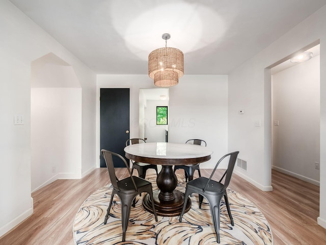 12609 Fancher Rd, Westerville, OH 43082 - dining room featuring light wood-type flooring and a chandelier