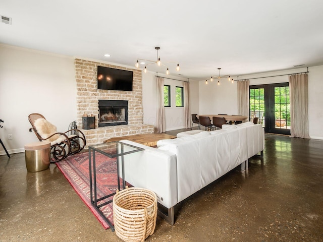 12609 Fancher Rd, Westerville, OH 43082 - living room with speckled floor, a brick fireplace, ornamental molding, and french doors
