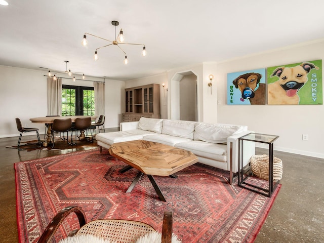 12609 Fancher Rd, Westerville, OH 43082 - living room featuring ornamental molding, a chandelier, and arched walkways
