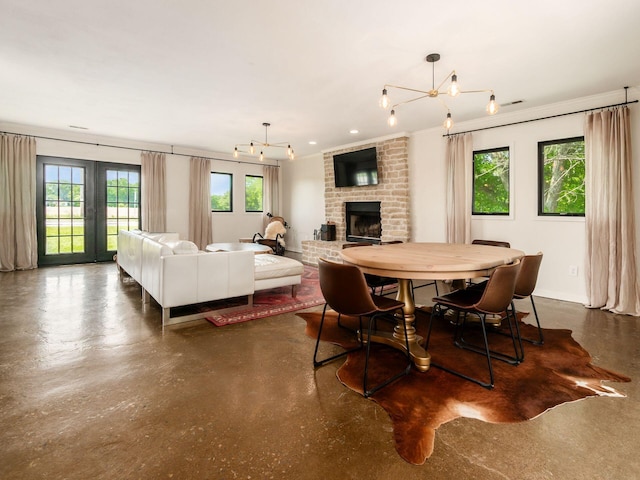 12609 Fancher Rd, Westerville, OH 43082 - dining area with concrete floors, a brick fireplace, and crown molding