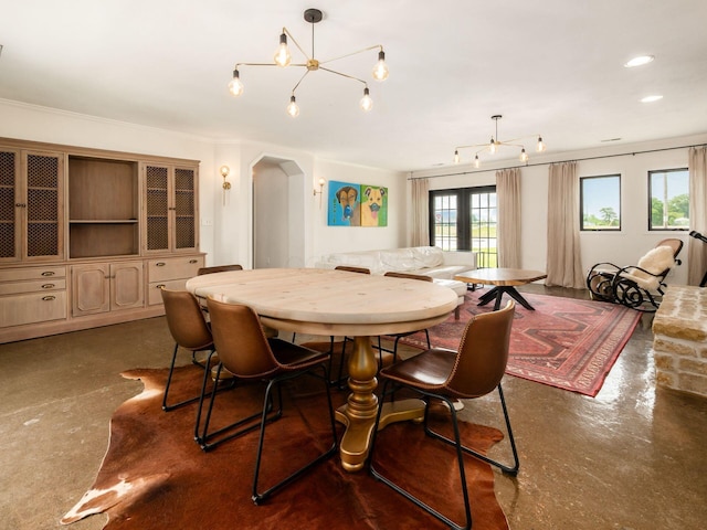 12609 Fancher Rd, Westerville, OH 43082 - dining space with arched walkways, finished concrete floors, and french doors