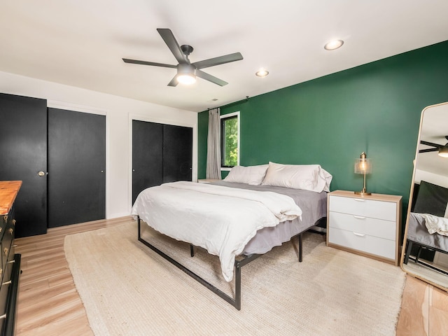 12609 Fancher Rd, Westerville, OH 43082 - bedroom featuring light wood-style floors, recessed lighting, a ceiling fan, and multiple closets