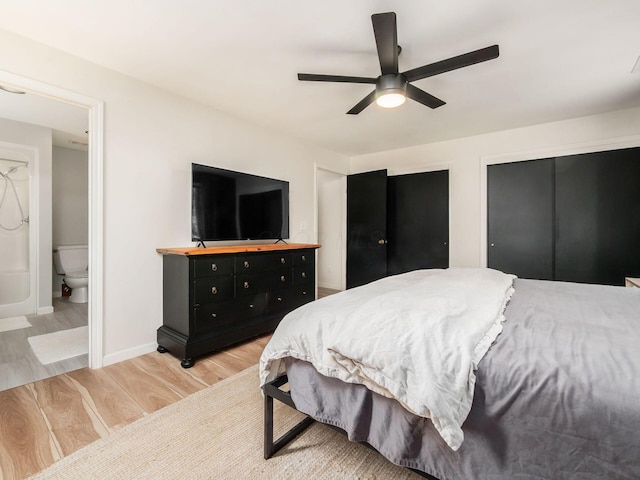 12609 Fancher Rd, Westerville, OH 43082 - bedroom featuring light wood-style floors, ensuite bath, a ceiling fan, and multiple closets