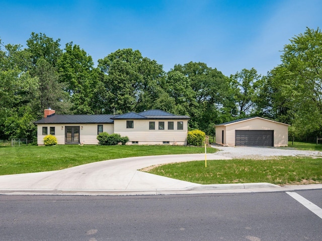 12609 Fancher Rd, Westerville, OH 43082 - single story home with a garage, an outdoor structure, a front lawn, a chimney, and french doors