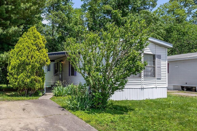 8764 National Rd SW Unit 118, Etna, OH 43062 - view of property hidden behind natural elements featuring a front lawn