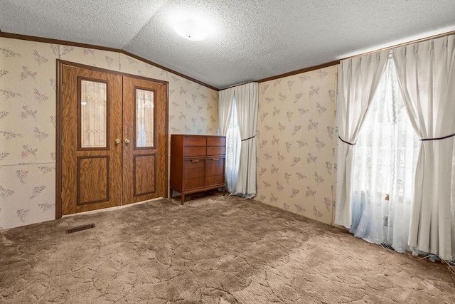 8764 National Rd SW Unit 118, Etna, OH 43062 - entrance foyer featuring wallpapered walls, crown molding, a textured ceiling, carpet flooring, and lofted ceiling