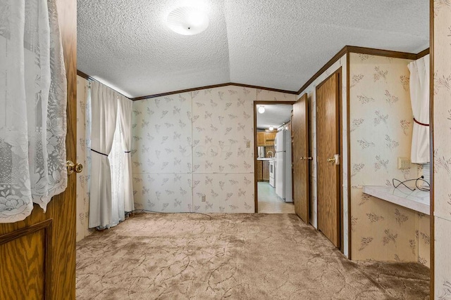 8764 National Rd SW Unit 118, Etna, OH 43062 - unfurnished bedroom featuring crown molding, light carpet, lofted ceiling, a textured ceiling, and wallpapered walls