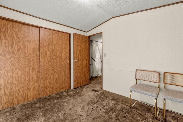 8764 National Rd SW Unit 118, Etna, OH 43062 - unfurnished room featuring lofted ceiling, carpet floors, ornamental molding, and a textured ceiling