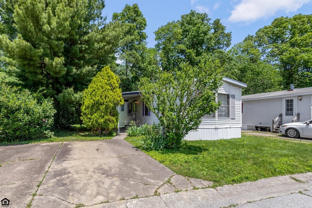 8764 National Rd SW Unit 118, Etna, OH 43062 - view of property hidden behind natural elements featuring a front lawn
