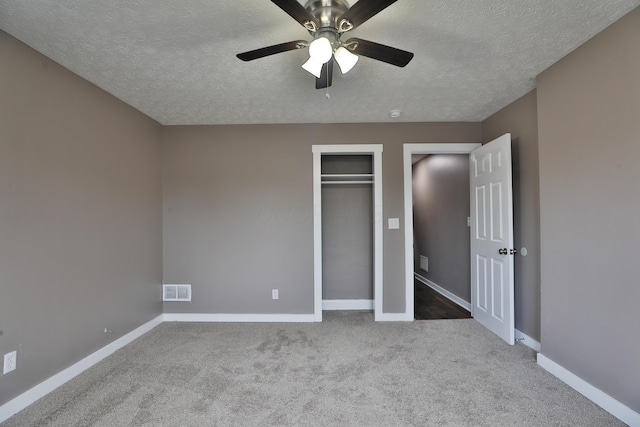 212-214 S Eureka Ave, Columbus, OH 43204 - unfurnished bedroom featuring a textured ceiling, carpet, baseboards, a closet, and ceiling fan