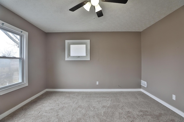 212-214 S Eureka Ave, Columbus, OH 43204 - spare room with healthy amount of natural light, carpet, a ceiling fan, and a textured ceiling