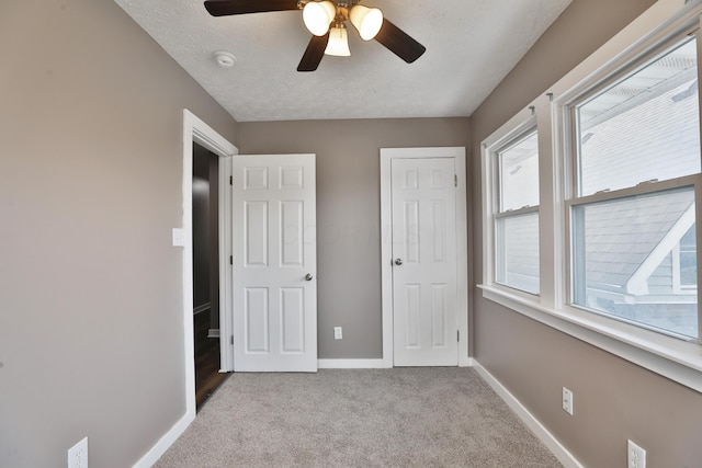 212-214 S Eureka Ave, Columbus, OH 43204 - unfurnished bedroom featuring baseboards, carpet, and a ceiling fan
