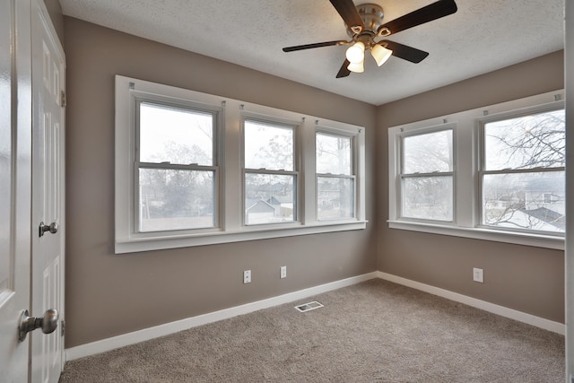 212-214 S Eureka Ave, Columbus, OH 43204 - unfurnished room with carpet floors, baseboards, a ceiling fan, and a textured ceiling