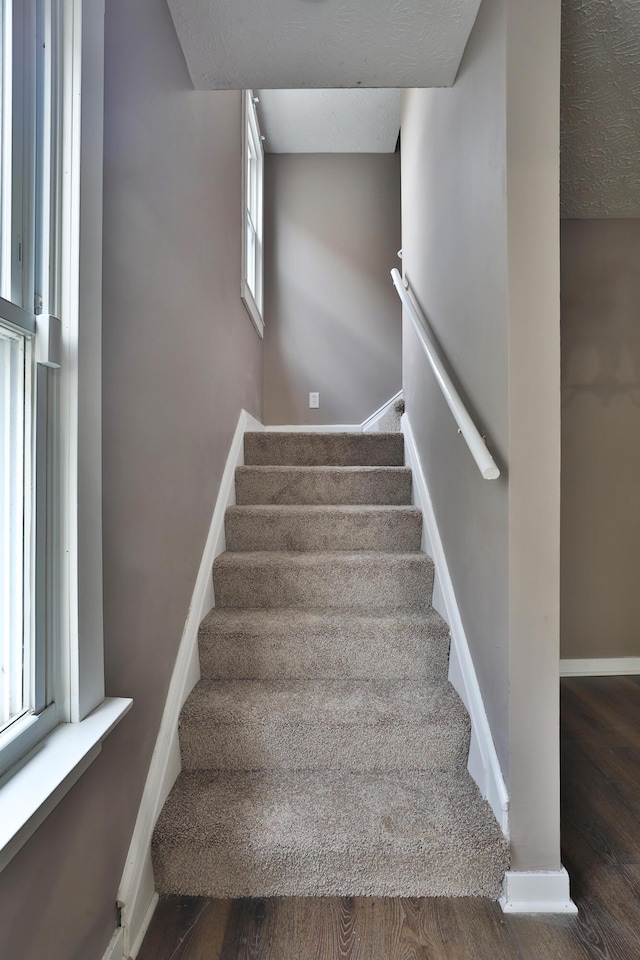212-214 S Eureka Ave, Columbus, OH 43204 - staircase with wood finished floors and baseboards
