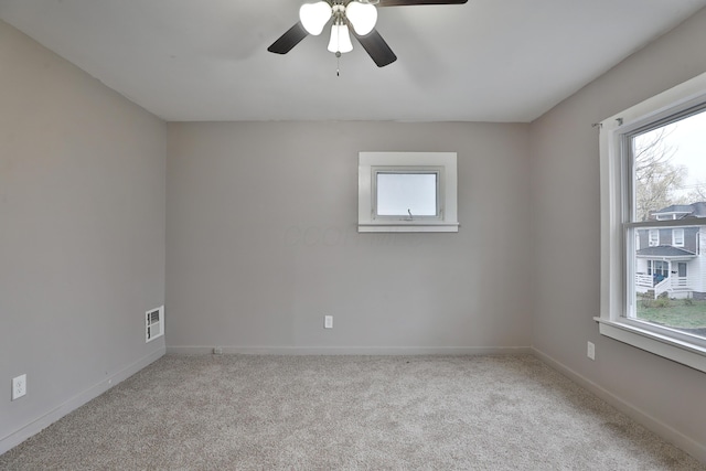 212-214 S Eureka Ave, Columbus, OH 43204 - carpeted spare room featuring healthy amount of natural light, a ceiling fan, and baseboards