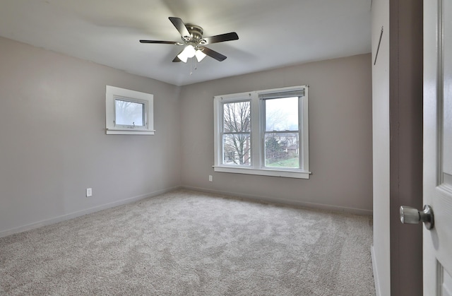212-214 S Eureka Ave, Columbus, OH 43204 - empty room with carpet floors, ceiling fan, and baseboards