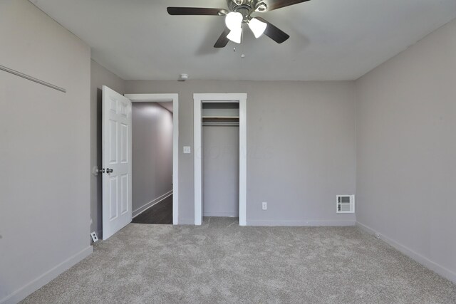 212-214 S Eureka Ave, Columbus, OH 43204 - unfurnished bedroom featuring carpet floors, baseboards, ceiling fan, and a closet