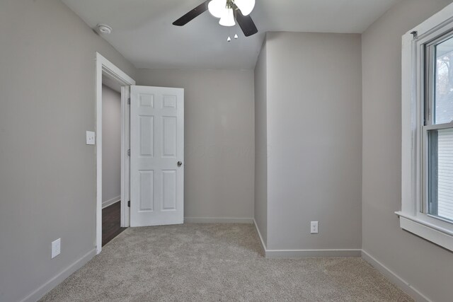 212-214 S Eureka Ave, Columbus, OH 43204 - spare room with carpet floors, ceiling fan, a smoke detector, and baseboards