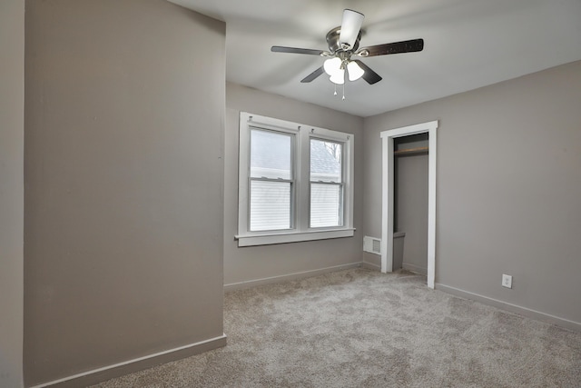 212-214 S Eureka Ave, Columbus, OH 43204 - unfurnished bedroom with carpet, baseboards, a ceiling fan, and a closet