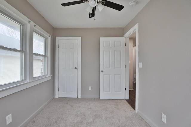 212-214 S Eureka Ave, Columbus, OH 43204 - unfurnished bedroom with carpet floors, baseboards, and a ceiling fan