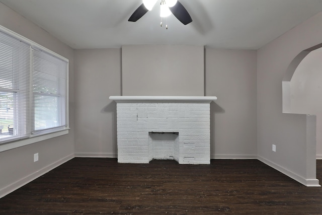 212-214 S Eureka Ave, Columbus, OH 43204 - unfurnished living room featuring a fireplace, a ceiling fan, wood finished floors, and baseboards
