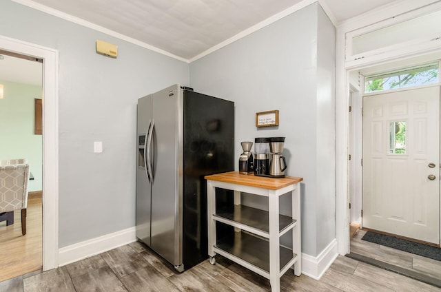 138 E Kelso Rd, Columbus, OH 43202 - kitchen with stainless steel refrigerator with ice dispenser, wood finished floors, crown molding, and baseboards
